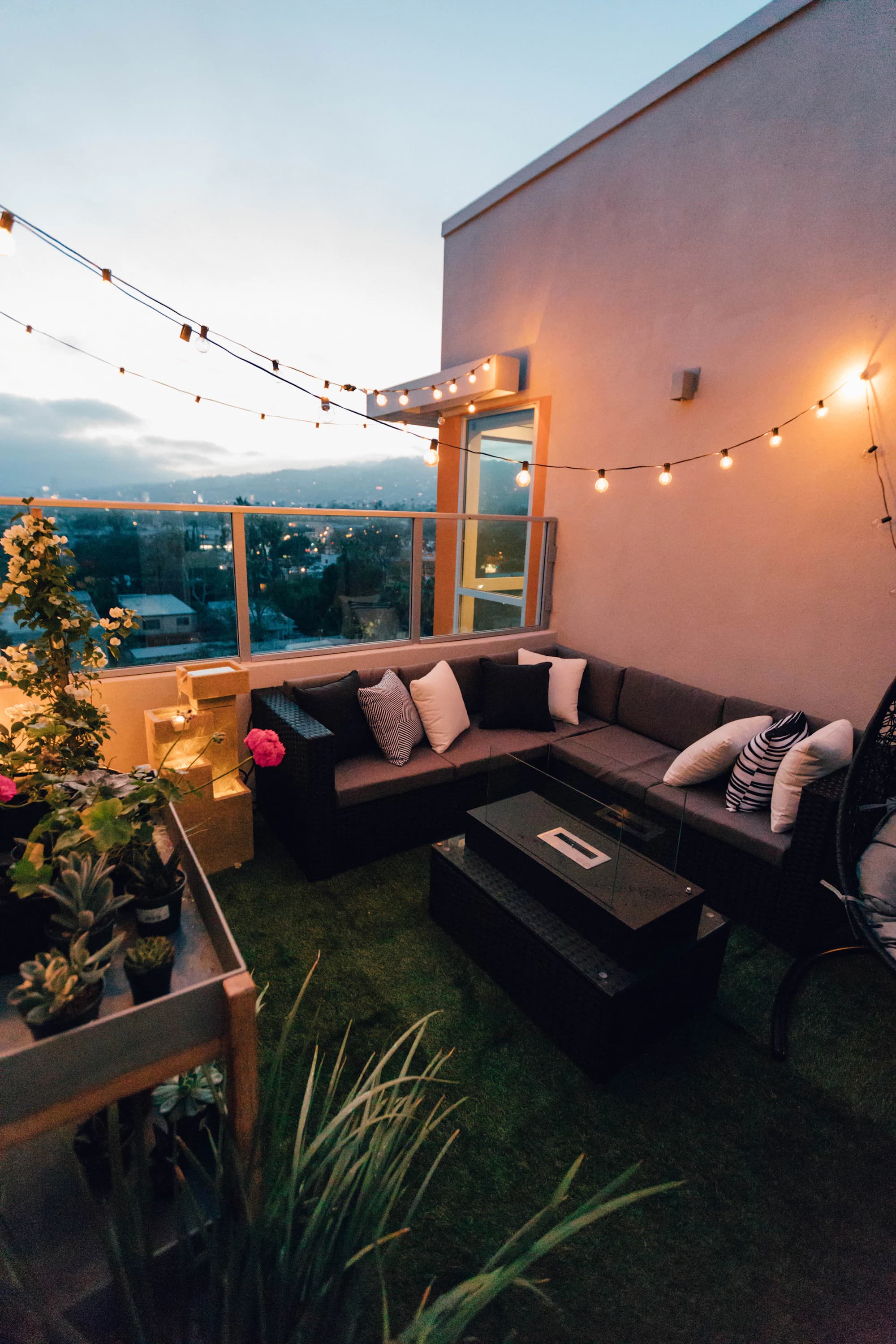 Corner balcony seating nook with uninterrupted high-floor skyline perspective